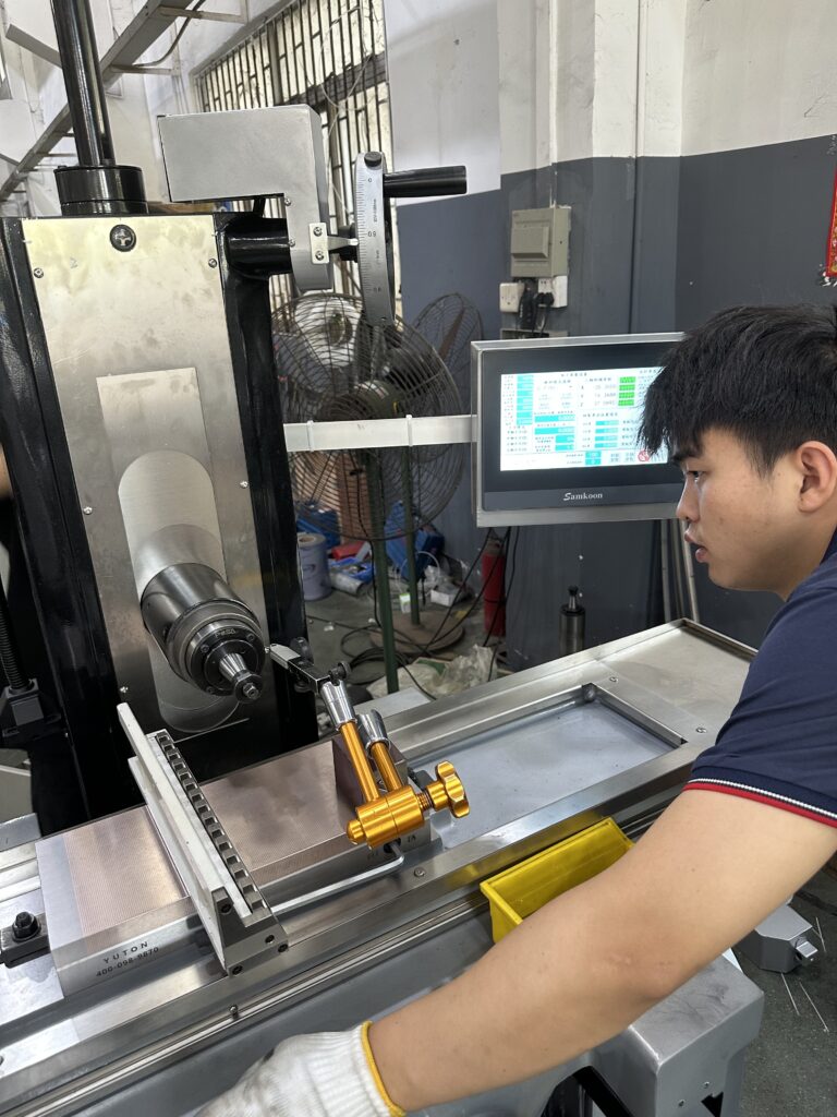 Engineer performing laser calibration for grinding machine accuracy maintenance