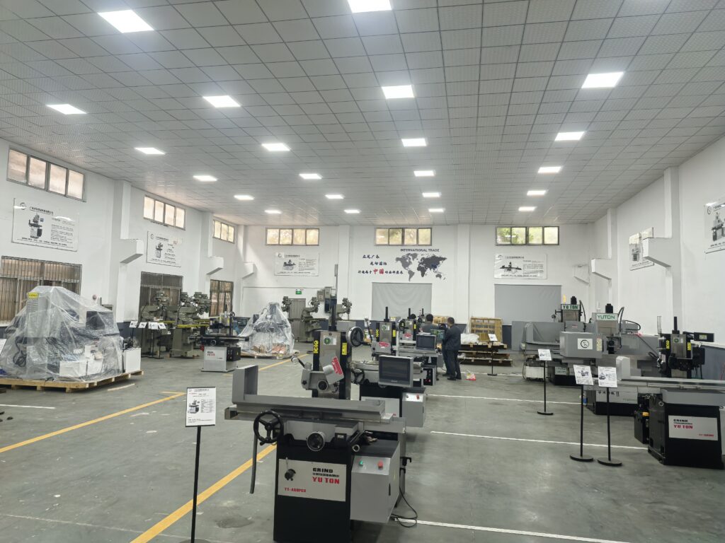 Showroom display of multiple YUTON surface grinder models, including CNC and hydraulic types, featured in the 2026 complete buying guide.