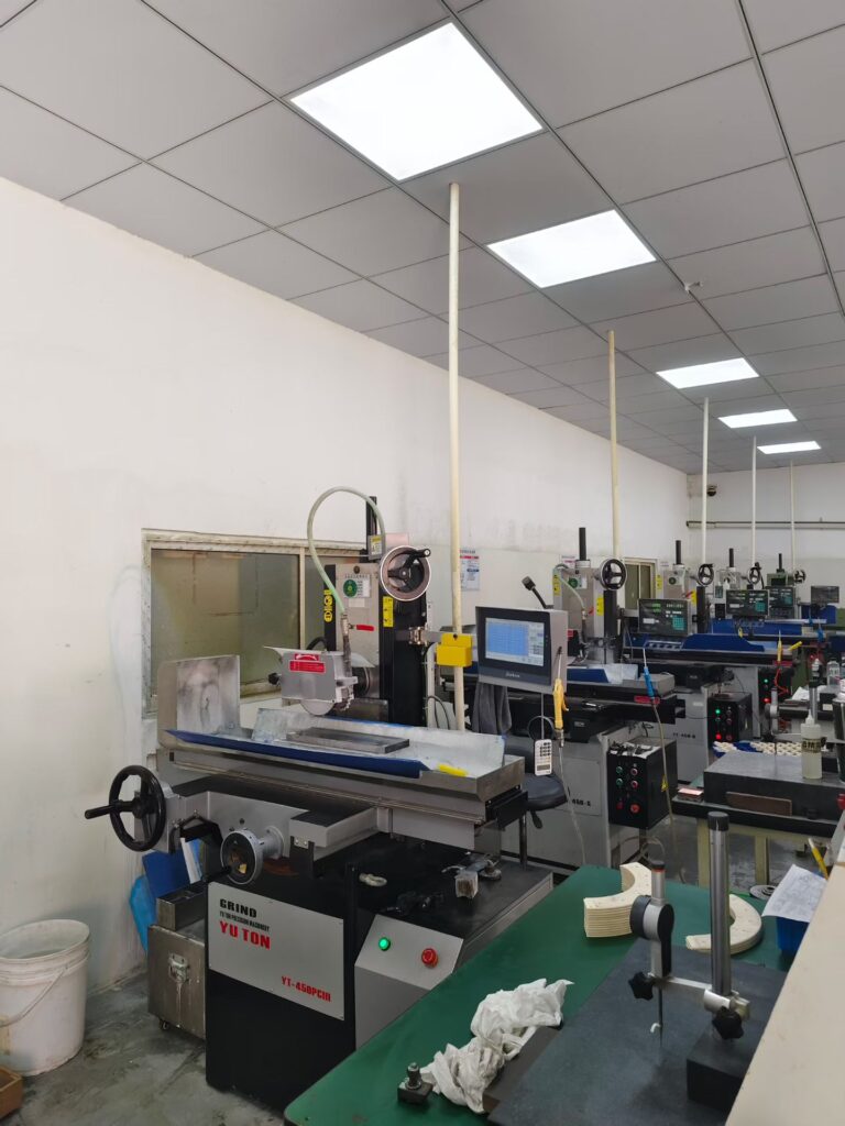 Row of YUTON ceramic grinding machines installed in customer factory for mass production