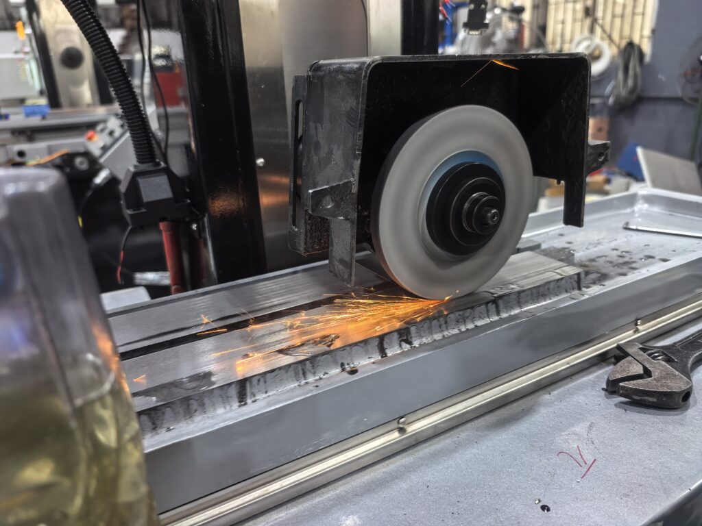 YUTON manual surface grinder metal grinding process with sparks on workpiece