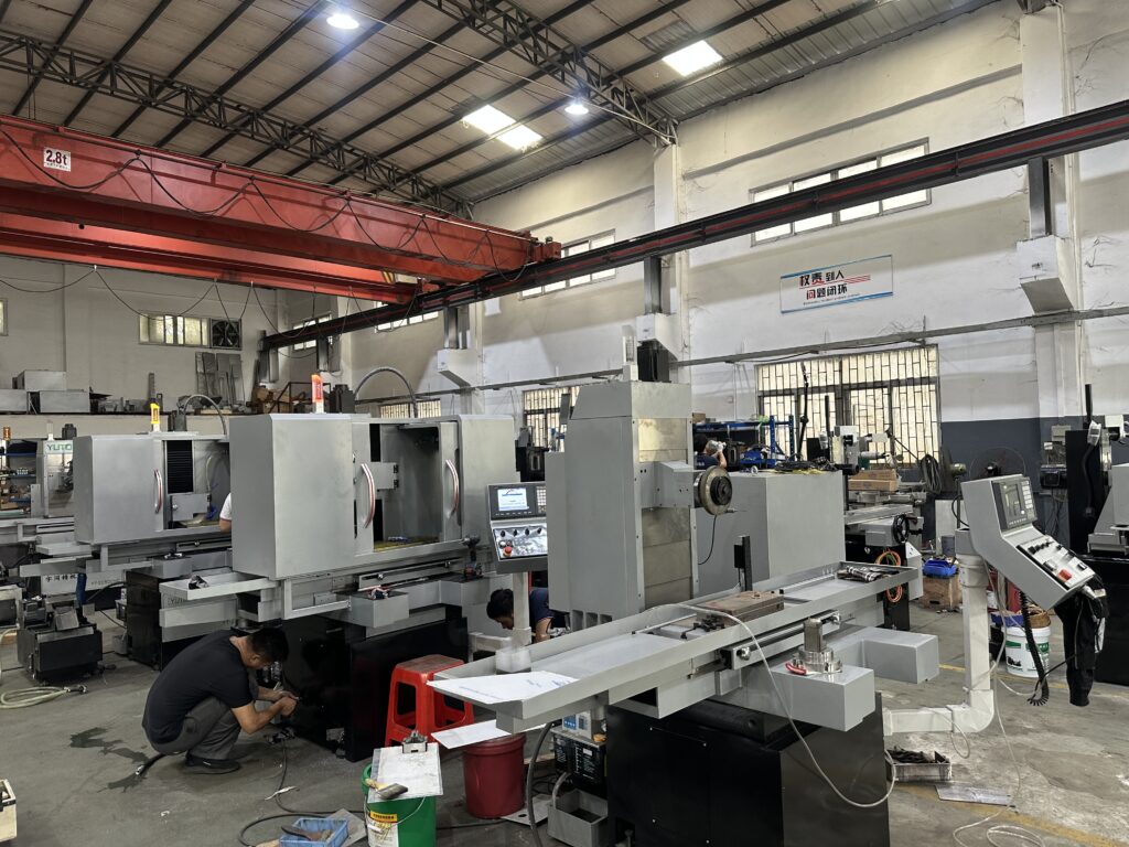 Full row of CNC precision grinders ready for assembly in YUTON manufacturing workshop