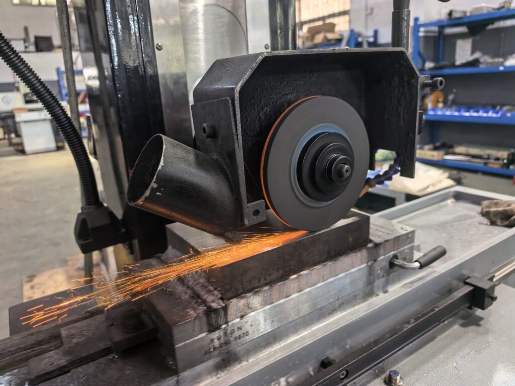 Surface grinding for hardened steel using a CNC surface grinder with coolant