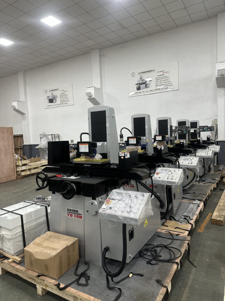 Row of YUTON automatic surface grinders in production at Dongguan precision grinder factory – ready for export shipment