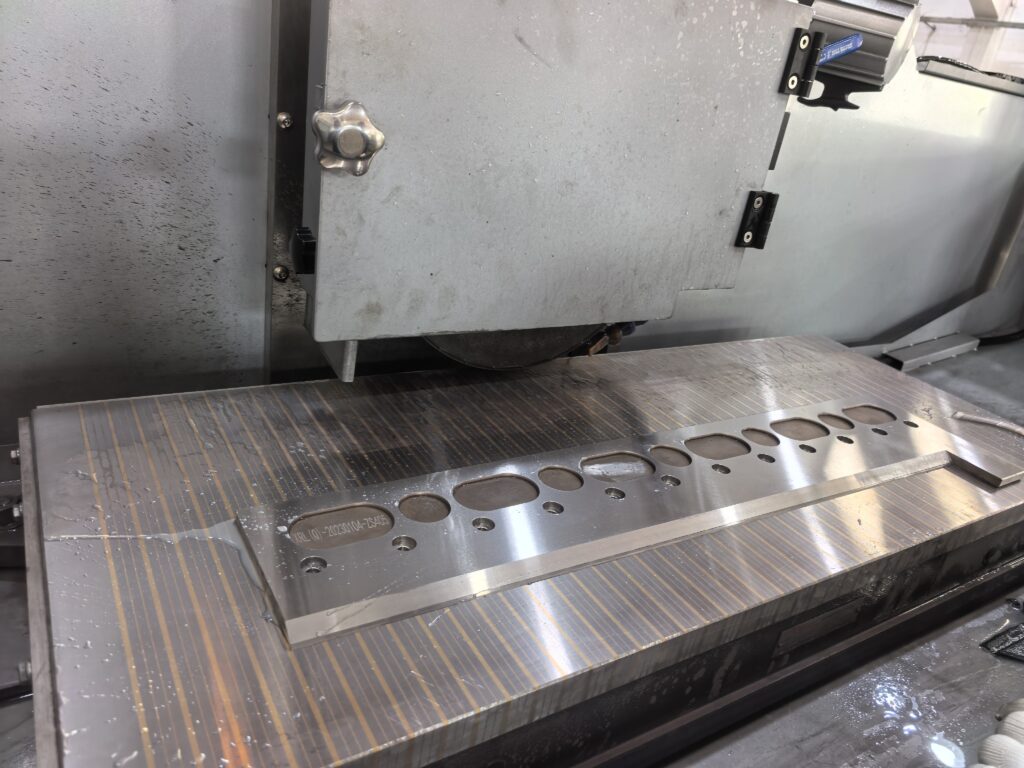 Surface grinder for die making machining precision mold components with a CNC grinder