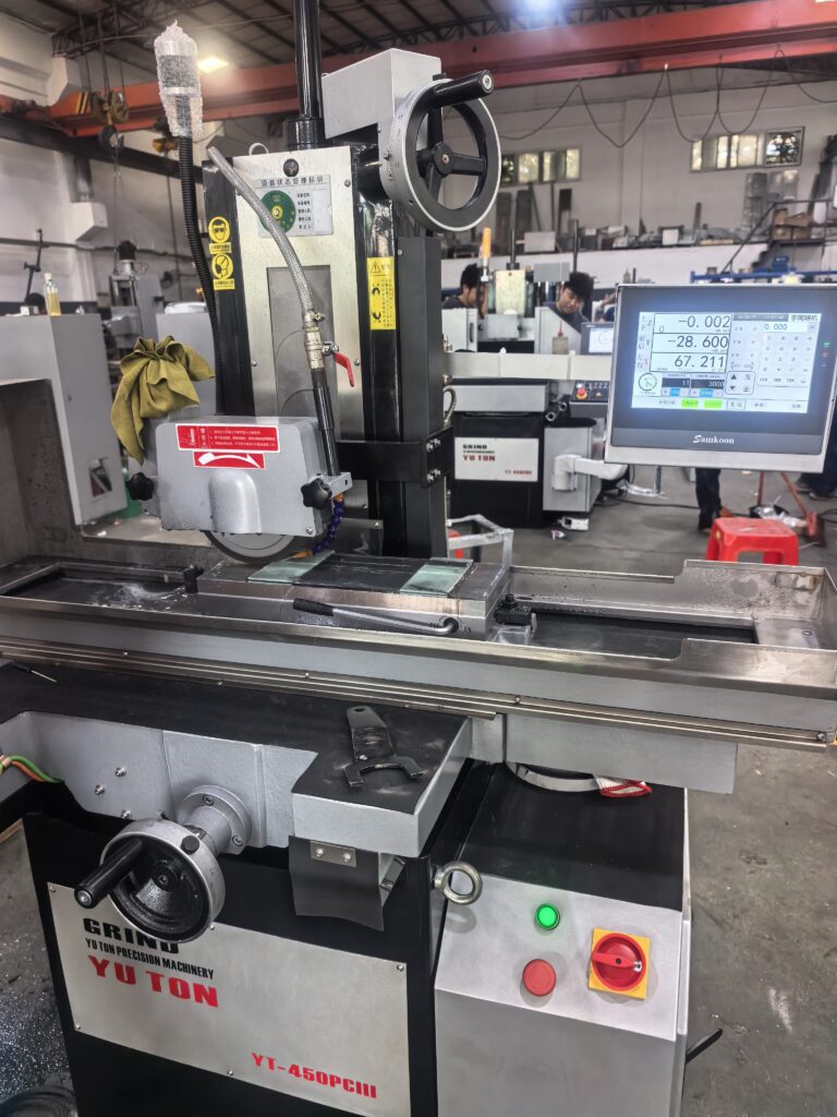Operator adjusting CNC grinding parameters to reduce grinding cost