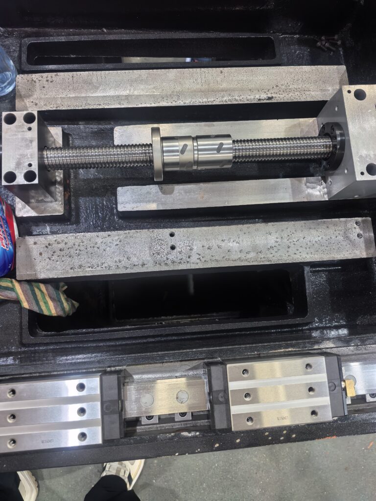Surface grinder calibration verifying table movement and guideway alignment