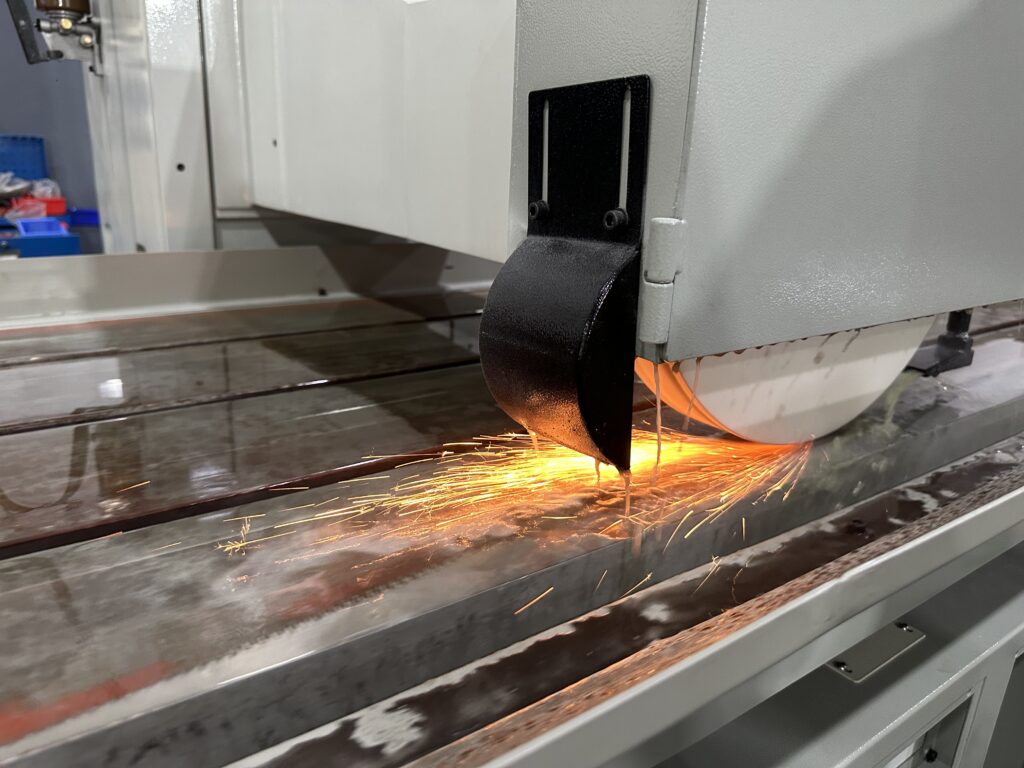 Hydraulic surface grinder for sale machining a steel workpiece with high precision