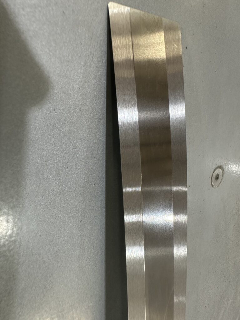 Surface grinding for stainless steel with optimized coolant application