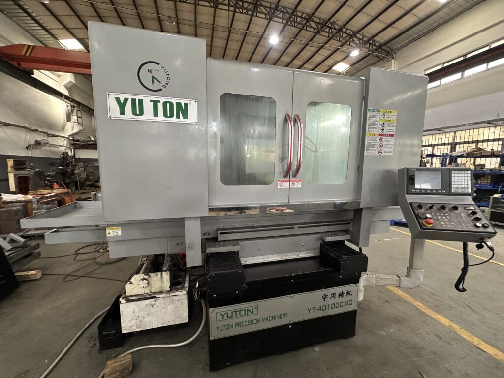 Lights-out grinding technology using automated CNC surface grinders for unmanned production