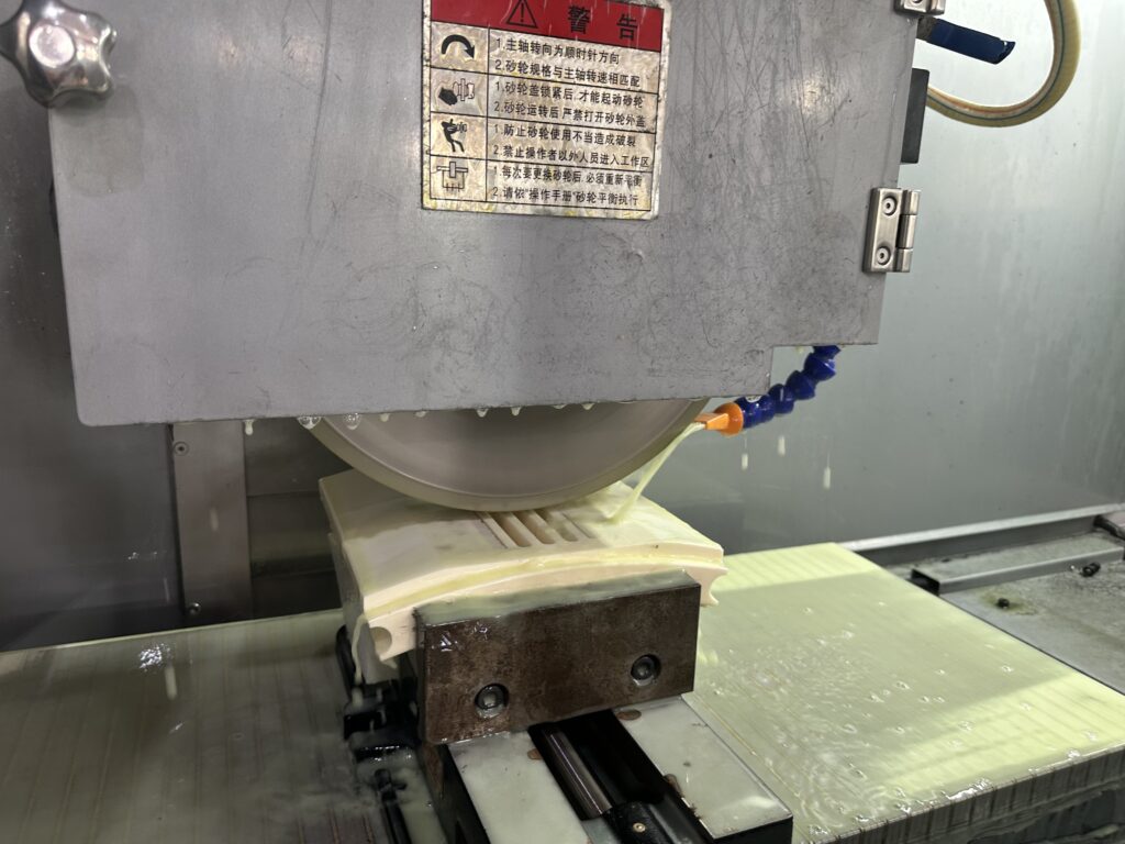 Diamond wheel grinding guide showing precision grinding with a diamond wheel in a production workshop