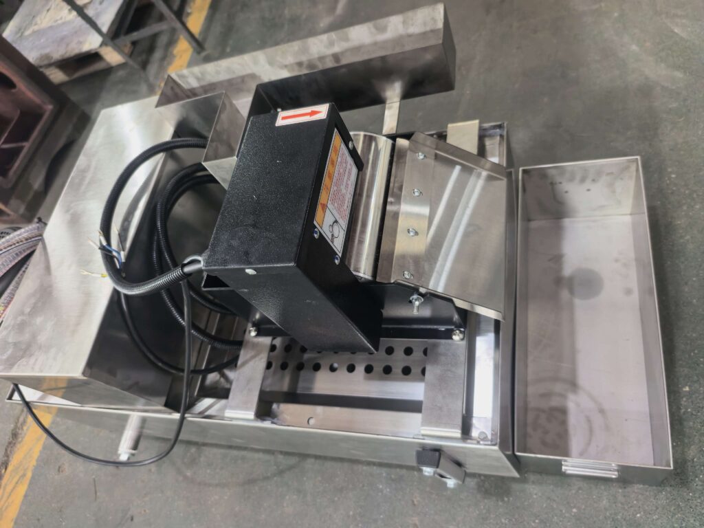 Surface grinder coolant guide showing coolant filtration system for precision grinding machines