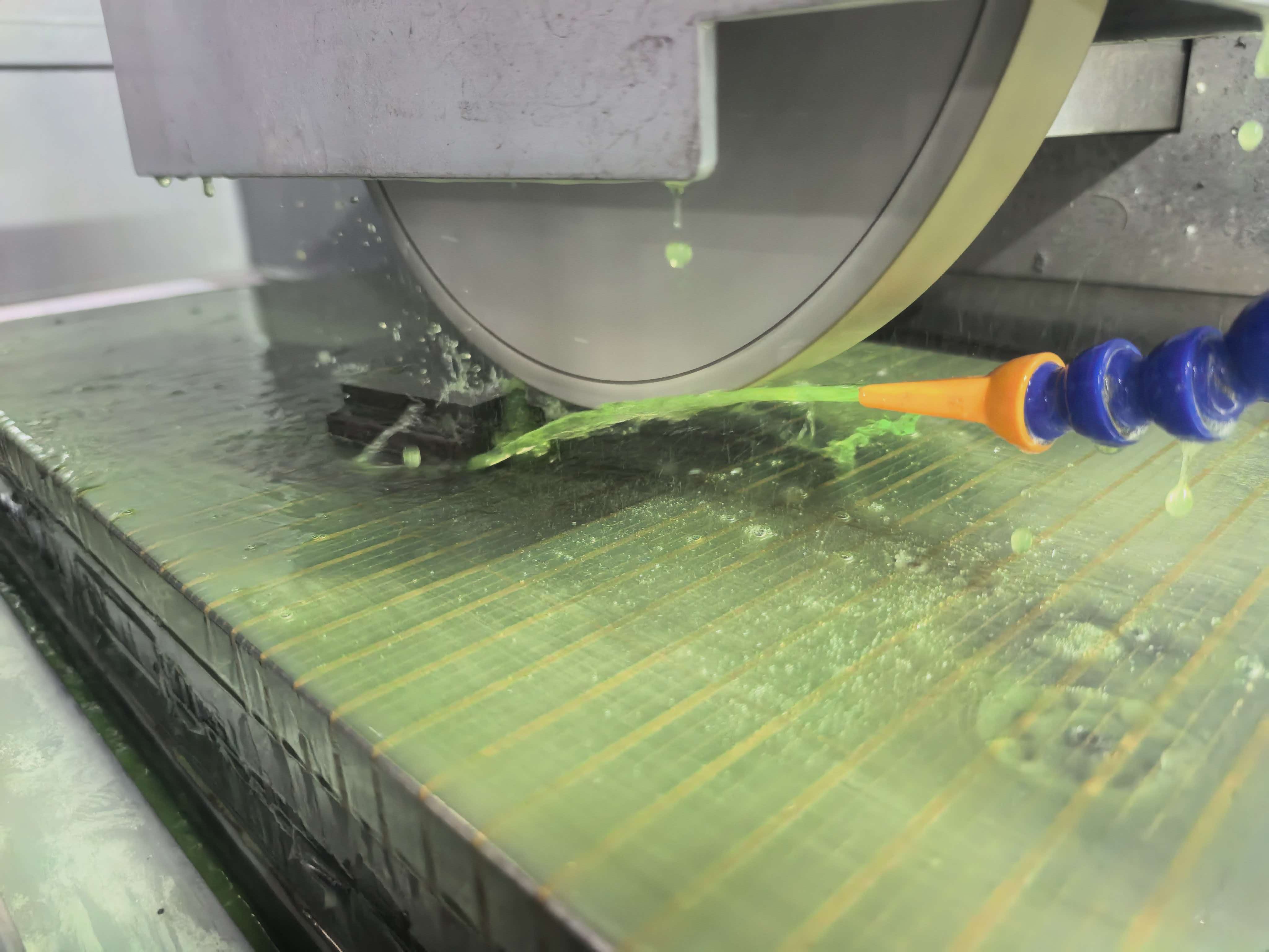 Surface grinder coolant guide demonstrating proper coolant nozzle positioning during grinding