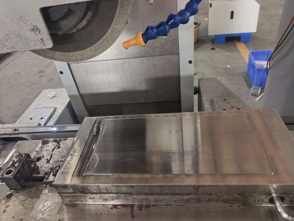 Surface grinder magnetic chuck installation and alignment using a dial indicator