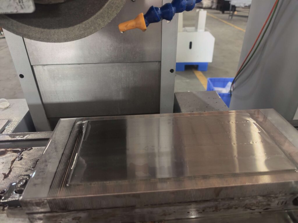 Surface grinder workholding with a permanent magnetic chuck for steel workpieces